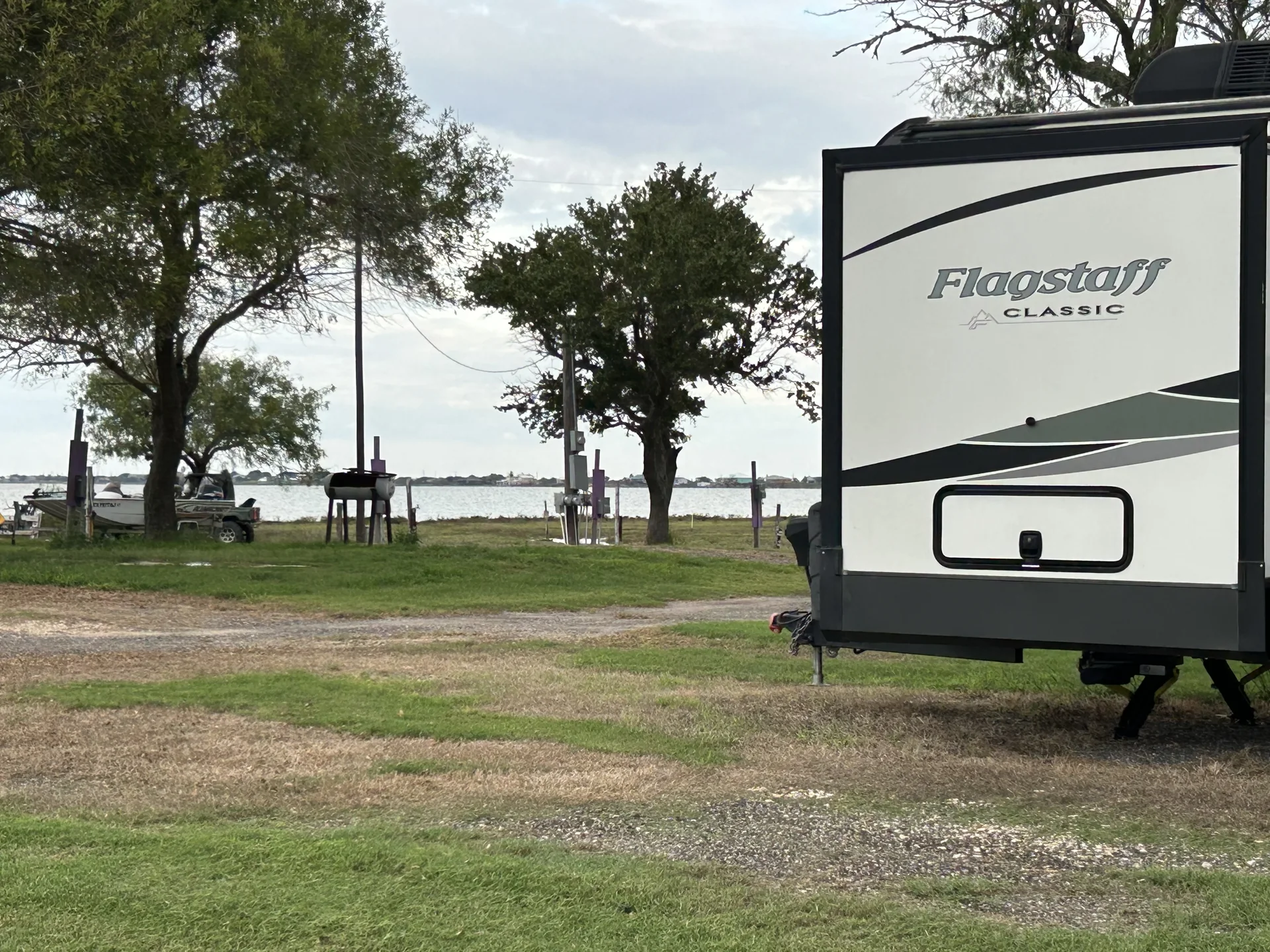 RV site with a view toward Copano Bay at Down By The Bay RV Resort